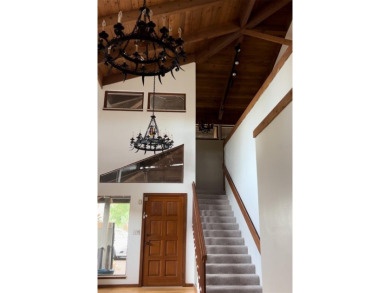 Soaring cedar ceilings, an abundance of natural light, and on The Dunedin Country Club in Florida - for sale on GolfHomes.com, golf home, golf lot