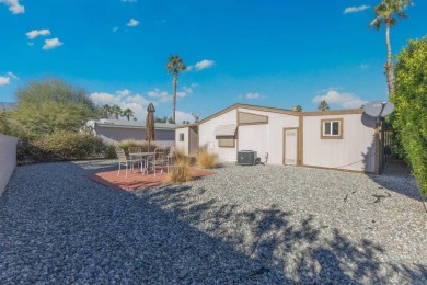 Welcome to this inviting 2-bedroom, 2-bath manufactured home on Cathedral Canyon Golf and Tennis Club in California - for sale on GolfHomes.com, golf home, golf lot