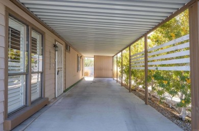 Welcome to this inviting 2-bedroom, 2-bath manufactured home on Cathedral Canyon Golf and Tennis Club in California - for sale on GolfHomes.com, golf home, golf lot