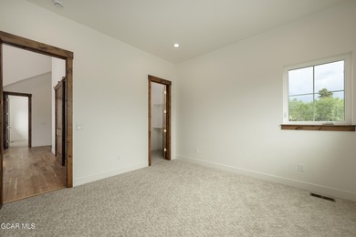 This Mountain Chic home is all about the views ! With windows on Headwaters Golf Course At Granby Ranch in Colorado - for sale on GolfHomes.com, golf home, golf lot