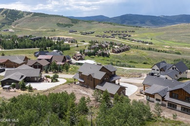 This Mountain Chic home is all about the views ! With windows on Headwaters Golf Course At Granby Ranch in Colorado - for sale on GolfHomes.com, golf home, golf lot