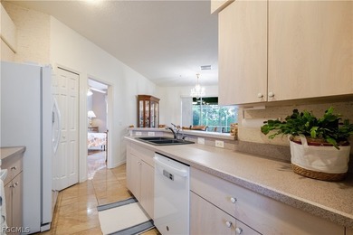 Nestled in a corner lot in Herons Glen this TURNKEY Ibis II home on Herons Glen Golf and Country Club in Florida - for sale on GolfHomes.com, golf home, golf lot