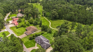 Elegantly perched in the prestigious Rayburn Country Subdivision on Rayburn Country Club in Texas - for sale on GolfHomes.com, golf home, golf lot