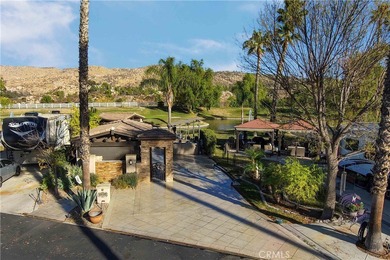 Check out the gated entry to this incredible waterfront on Rancho California RV Resort in California - for sale on GolfHomes.com, golf home, golf lot