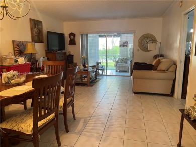 Beautiful 2-bedroom, 2-bathroom CORNER AND FIRST FLOOR condo in on Oriole Golf and Tennis Club in Florida - for sale on GolfHomes.com, golf home, golf lot