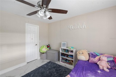 Welcome to this beautifully updated 4-bedroom, 2-bathroom pool on Deep Creek Golf Club in Florida - for sale on GolfHomes.com, golf home, golf lot