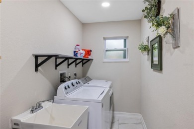 Welcome to this beautifully updated 4-bedroom, 2-bathroom pool on Deep Creek Golf Club in Florida - for sale on GolfHomes.com, golf home, golf lot