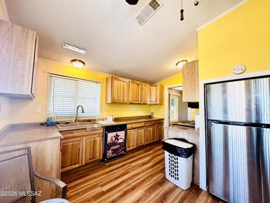 Step into this vibrant manufactured home just minutes from the on Mt. Graham Municipal Golf Course in Arizona - for sale on GolfHomes.com, golf home, golf lot