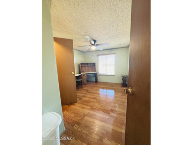 Step into this vibrant manufactured home just minutes from the on Mt. Graham Municipal Golf Course in Arizona - for sale on GolfHomes.com, golf home, golf lot