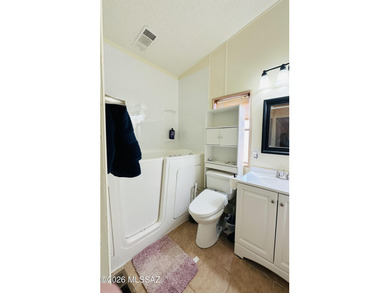 Step into this vibrant manufactured home just minutes from the on Mt. Graham Municipal Golf Course in Arizona - for sale on GolfHomes.com, golf home, golf lot