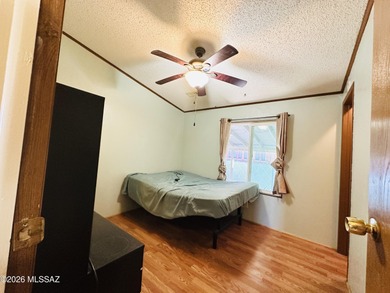 Step into this vibrant manufactured home just minutes from the on Mt. Graham Municipal Golf Course in Arizona - for sale on GolfHomes.com, golf home, golf lot