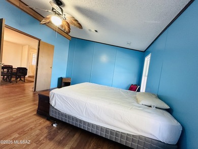 Step into this vibrant manufactured home just minutes from the on Mt. Graham Municipal Golf Course in Arizona - for sale on GolfHomes.com, golf home, golf lot