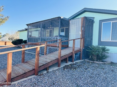 Step into this vibrant manufactured home just minutes from the on Mt. Graham Municipal Golf Course in Arizona - for sale on GolfHomes.com, golf home, golf lot