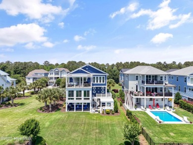 This modern luxury home offers a spectacular waterfront on Members Club At St. James Plantation in North Carolina - for sale on GolfHomes.com, golf home, golf lot