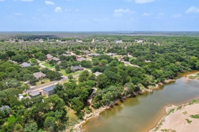This riverfront lot offers an exceptional blend of natural on Pecan Plantation Country Club in Texas - for sale on GolfHomes.com, golf home, golf lot