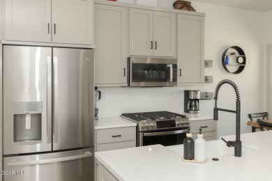 Discover this fully furnished, move-in-ready 1,360 sqft on Grand Elk Ranch and Club in Colorado - for sale on GolfHomes.com, golf home, golf lot