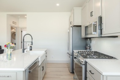 Discover this fully furnished, move-in-ready 1,360 sqft on Grand Elk Ranch and Club in Colorado - for sale on GolfHomes.com, golf home, golf lot
