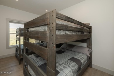 Discover this fully furnished, move-in-ready 1,360 sqft on Grand Elk Ranch and Club in Colorado - for sale on GolfHomes.com, golf home, golf lot