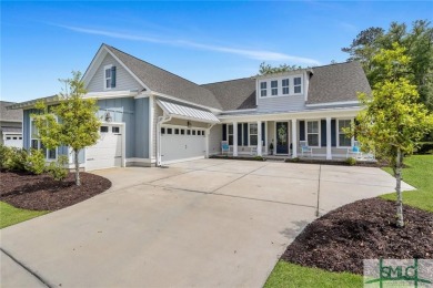 This modern home boasts luxury upgrades throughout, including a on Savannah Quarters Country Club in Georgia - for sale on GolfHomes.com, golf home, golf lot