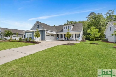 This modern home boasts luxury upgrades throughout, including a on Savannah Quarters Country Club in Georgia - for sale on GolfHomes.com, golf home, golf lot