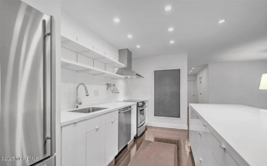 Experience modern elegance in this stunning top-floor condo on Pine Brook Golf Course in New Jersey - for sale on GolfHomes.com, golf home, golf lot