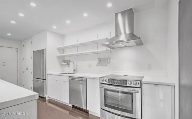 Experience modern elegance in this stunning top-floor condo on Pine Brook Golf Course in New Jersey - for sale on GolfHomes.com, golf home, golf lot