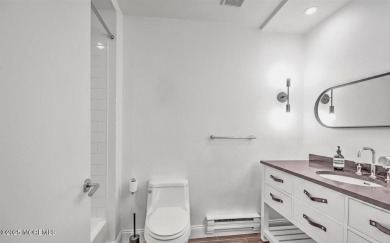 Experience modern elegance in this stunning top-floor condo on Pine Brook Golf Course in New Jersey - for sale on GolfHomes.com, golf home, golf lot