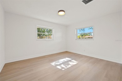 Beautifully renovated, this 3 bed, 2 bath home has over 1,600 on Countryside Country Club in Florida - for sale on GolfHomes.com, golf home, golf lot