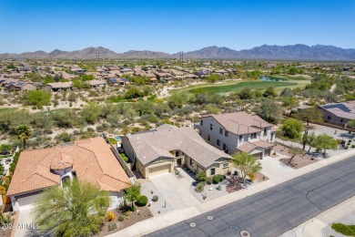 This home is a luxurious desert retreat with mountain views in on Estrella Mountain Ranch Golf Course in Arizona - for sale on GolfHomes.com, golf home, golf lot