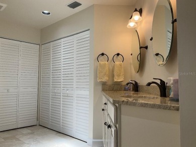 BEAUTIFULLY RENOVATED HURRICANE IMPACT WINDOWS NEW TRAVERTINE on Plantation Golf and Country Club in Florida - for sale on GolfHomes.com, golf home, golf lot