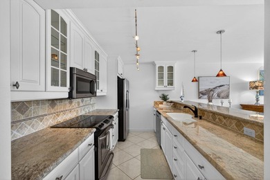 Set on the world-famous PGA Fazio course, this spacious on PGA National Golf Club in Florida - for sale on GolfHomes.com, golf home, golf lot