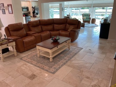 BEAUTIFULLY RENOVATED HURRICANE IMPACT WINDOWS NEW TRAVERTINE on Plantation Golf and Country Club in Florida - for sale on GolfHomes.com, golf home, golf lot