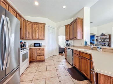 Charming 3-bedroom, 2-bathroom plus den home located in the on Harbor Hills Country Club in Florida - for sale on GolfHomes.com, golf home, golf lot