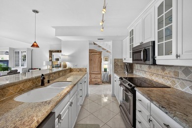 Set on the world-famous PGA Fazio course, this spacious on PGA National Golf Club in Florida - for sale on GolfHomes.com, golf home, golf lot