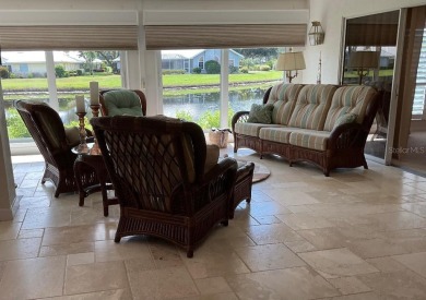 BEAUTIFULLY RENOVATED HURRICANE IMPACT WINDOWS NEW TRAVERTINE on Plantation Golf and Country Club in Florida - for sale on GolfHomes.com, golf home, golf lot