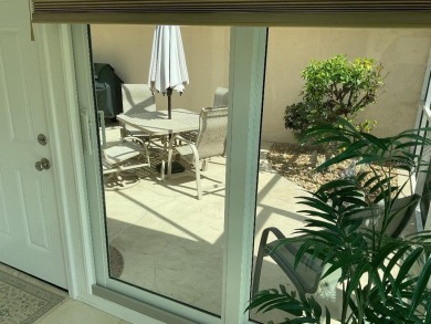 BEAUTIFULLY RENOVATED HURRICANE IMPACT WINDOWS NEW TRAVERTINE on Plantation Golf and Country Club in Florida - for sale on GolfHomes.com, golf home, golf lot