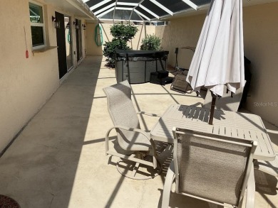 BEAUTIFULLY RENOVATED HURRICANE IMPACT WINDOWS NEW TRAVERTINE on Plantation Golf and Country Club in Florida - for sale on GolfHomes.com, golf home, golf lot