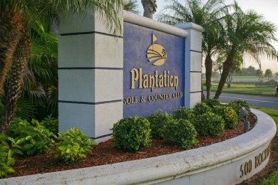 BEAUTIFULLY RENOVATED HURRICANE IMPACT WINDOWS NEW TRAVERTINE on Plantation Golf and Country Club in Florida - for sale on GolfHomes.com, golf home, golf lot