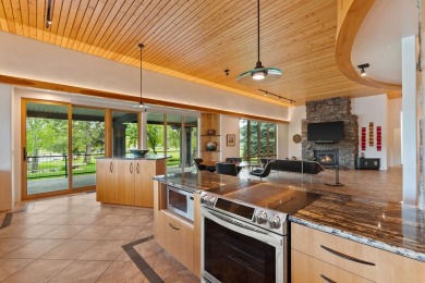 Experience waterfront luxury  mountain serenity in this on Eagle Bend Golf Course in Montana - for sale on GolfHomes.com, golf home, golf lot