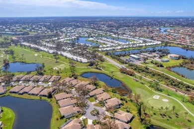 BEAUTIFULLY RENOVATED HURRICANE IMPACT WINDOWS NEW TRAVERTINE on Plantation Golf and Country Club in Florida - for sale on GolfHomes.com, golf home, golf lot