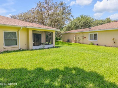 Welcome to easy, maintenance-free living in this charming on Turnbull Bay Golf Club in Florida - for sale on GolfHomes.com, golf home, golf lot