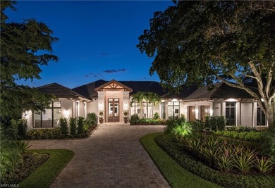 Discover refined coastal luxury in this exceptional estate on Club at Pelican Bay Golf Course in Florida - for sale on GolfHomes.com, golf home, golf lot