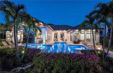 Discover refined coastal luxury in this exceptional estate on Club at Pelican Bay Golf Course in Florida - for sale on GolfHomes.com, golf home, golf lot