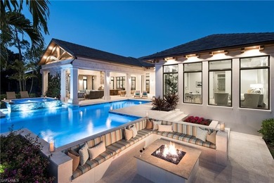 Discover refined coastal luxury in this exceptional estate on Club at Pelican Bay Golf Course in Florida - for sale on GolfHomes.com, golf home, golf lot