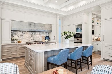 Discover refined coastal luxury in this exceptional estate on Club at Pelican Bay Golf Course in Florida - for sale on GolfHomes.com, golf home, golf lot