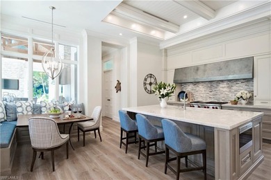 Discover refined coastal luxury in this exceptional estate on Club at Pelican Bay Golf Course in Florida - for sale on GolfHomes.com, golf home, golf lot