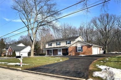 This beautiful brick home in Warwick Hills Golf Community offers on Warwick Hills Golf and Country Club in Michigan - for sale on GolfHomes.com, golf home, golf lot