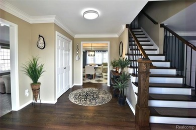 This beautiful brick home in Warwick Hills Golf Community offers on Warwick Hills Golf and Country Club in Michigan - for sale on GolfHomes.com, golf home, golf lot