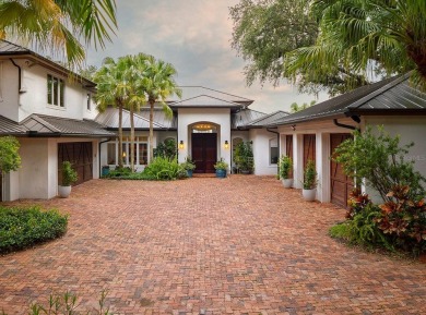 Experience refined lakefront living in this exceptional estate on Isleworth Golf and Country Club in Florida - for sale on GolfHomes.com, golf home, golf lot