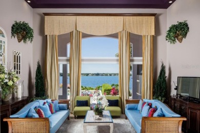 Experience refined lakefront living in this exceptional estate on Isleworth Golf and Country Club in Florida - for sale on GolfHomes.com, golf home, golf lot